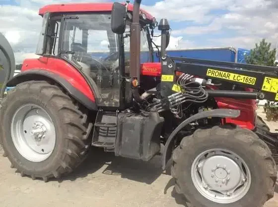Ciągnik rolniczy Pronar 1221 A2 2010 r z ładowaczem czołowym Pronara (widły + łyżka)